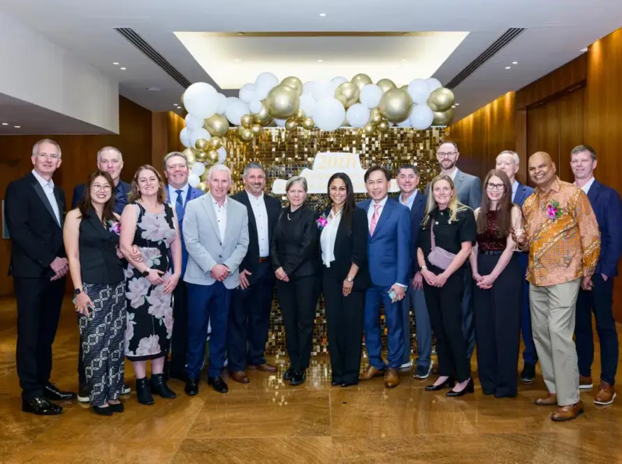 Corporate anniversary photo wall with gold balloons and sequins for Pfizer in Singapore