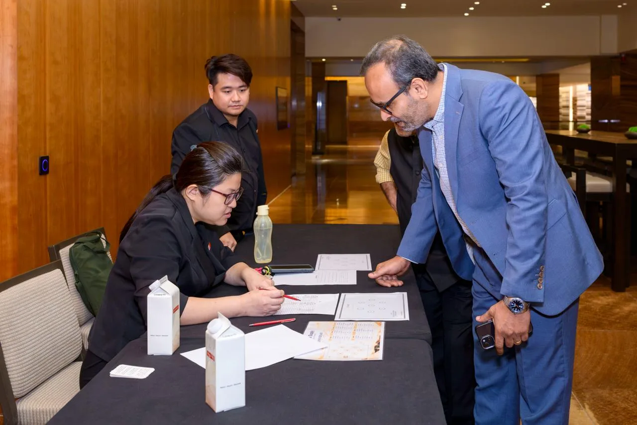Guest registration desk at a corporate anniversary event in Singapore